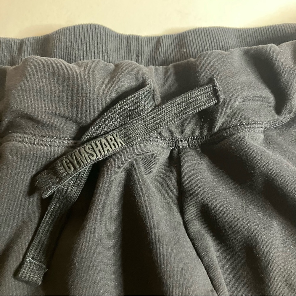 Gymshark Black sweatshirt material Athletic Shorts. Waist tie. Zipper pockets. - Picture 4 of 10
